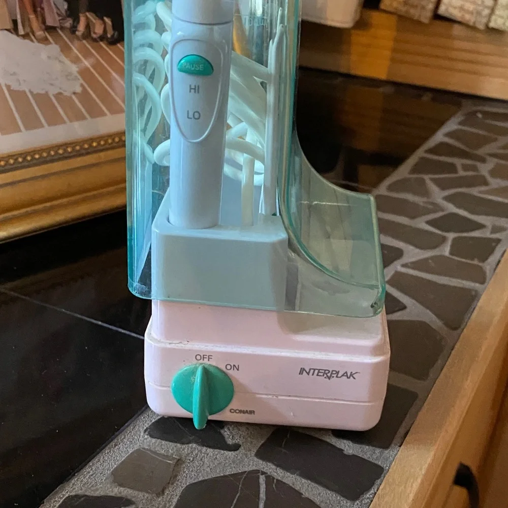 Electric Toothbrush with Aqua and White Design